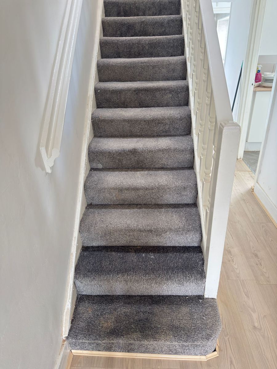 Staircase carpet before professional cleaning